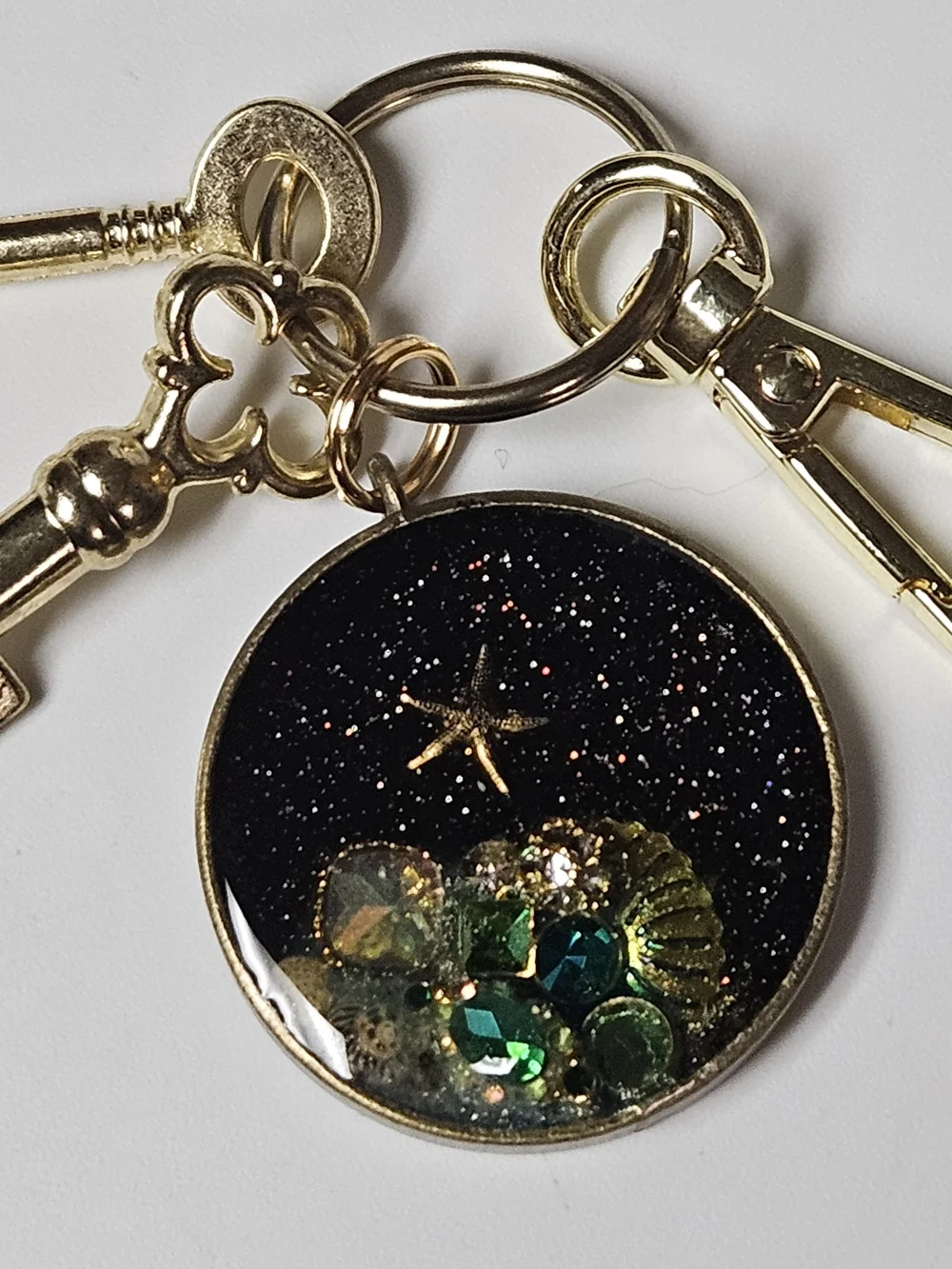 Gold Acquatic Keychain Bag Charm Black Galaxy and Green Crystal Accents